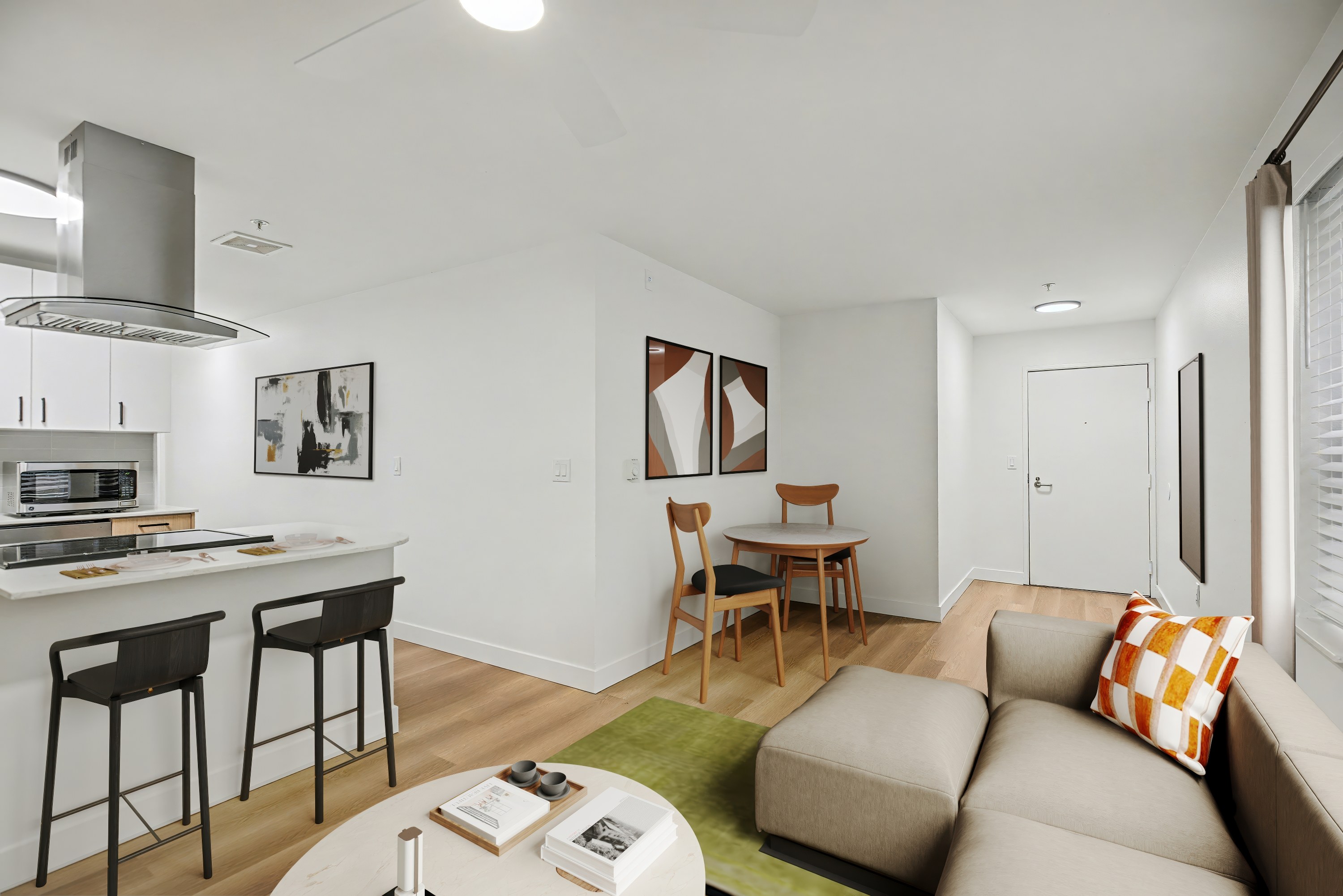 A modern kitchen with a bar area and a living room area.